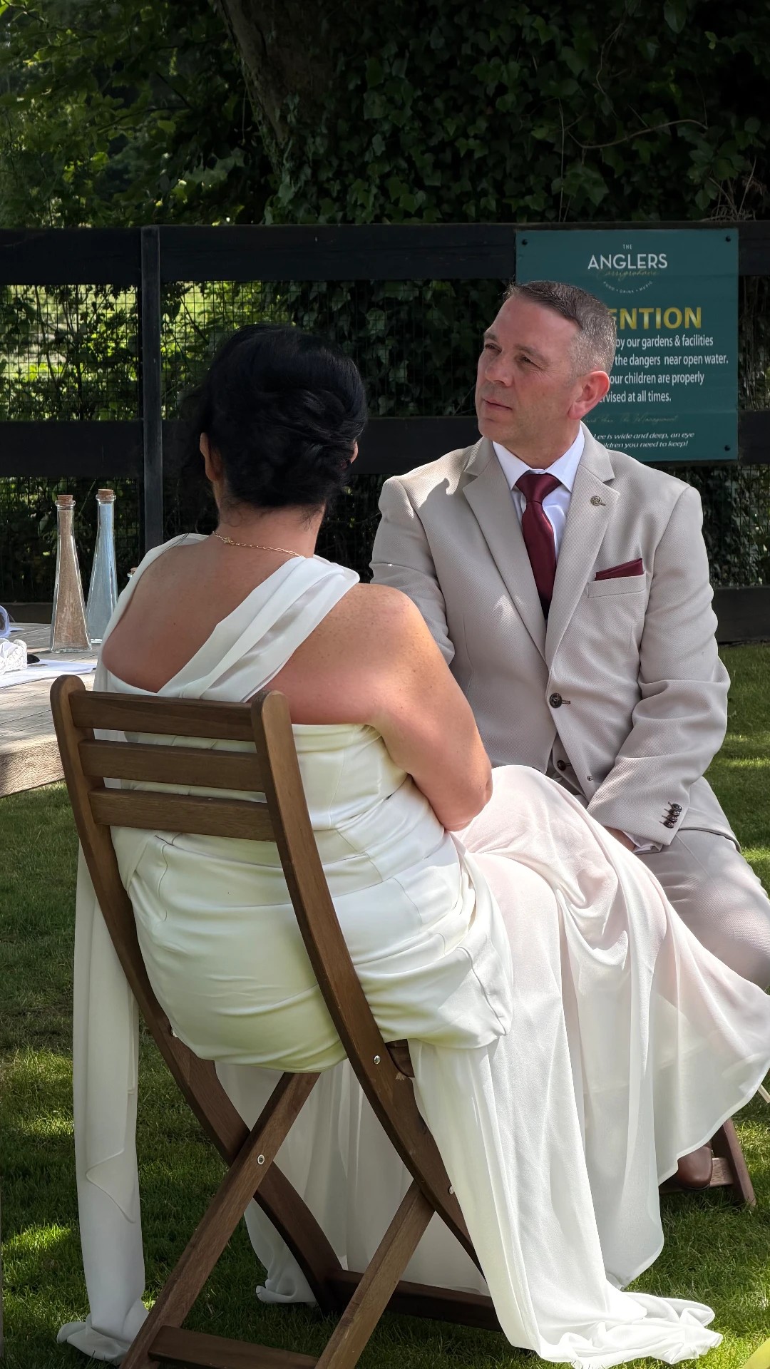 Yvonne and Trevor sitting together in the gardens at Anglers Rest