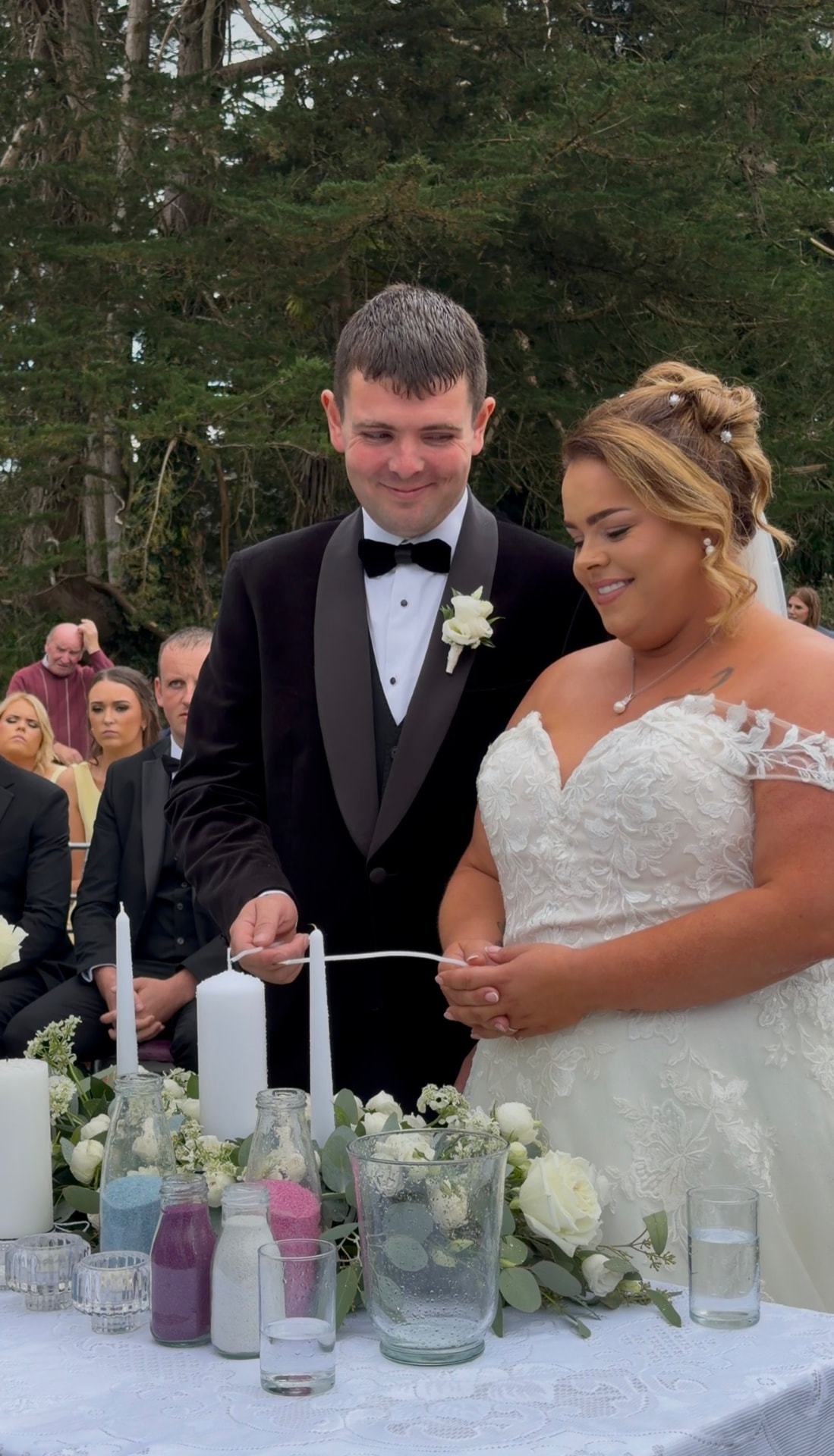 Teaghan and Tony lighting their unity candle during the ceremony